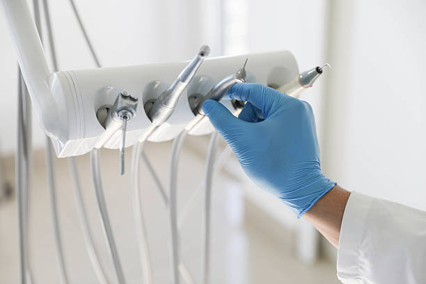 Professional Tooth Extraction technician working in Cavalero, WA